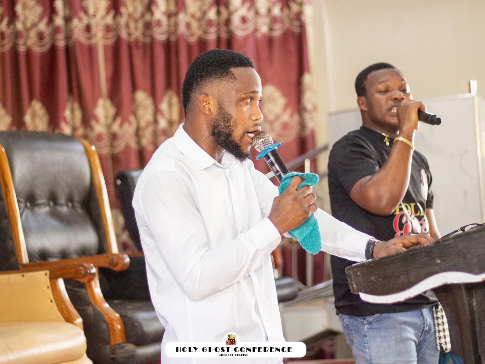 A Midnight Roaring minister leading the Holy Ghost Conference