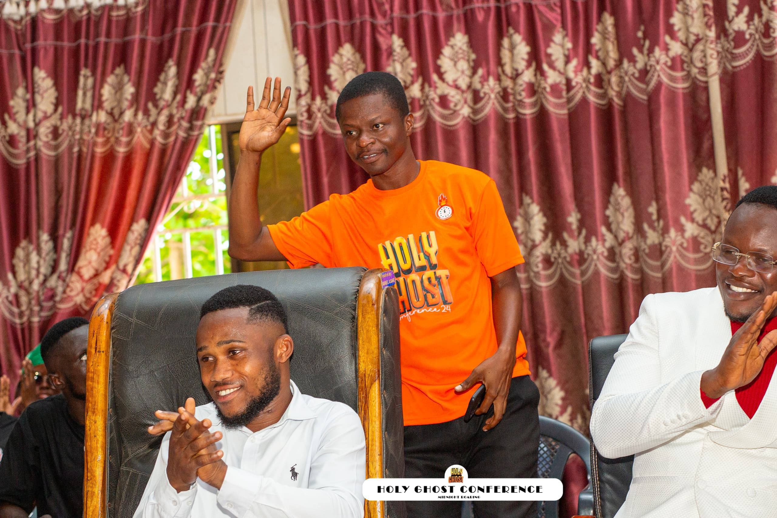 Conference guests applauding during a joyful moment