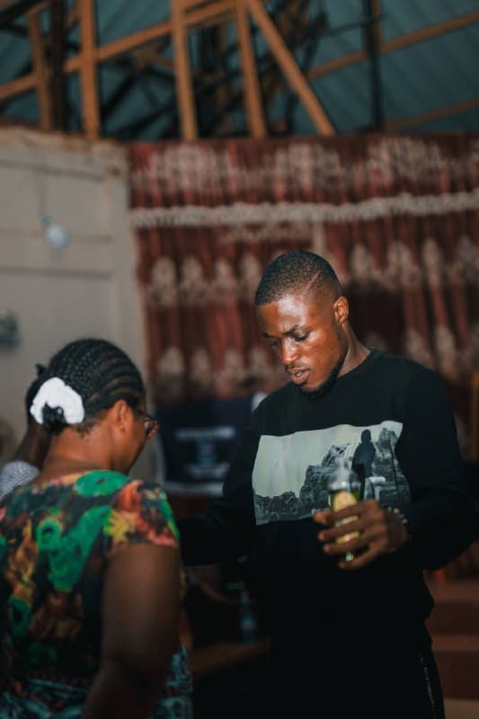 A minister praying with a woman during the conference